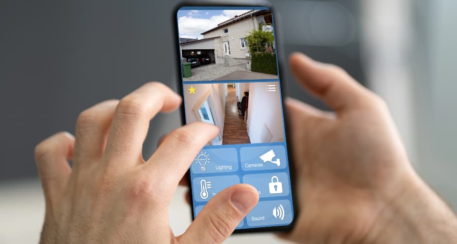 Homeowner examining surveillance camera footage on a smartphone
